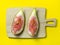 sliced figs on a cutting board. Juicy ripe fruit on a yellow background. Diet food. Fig isolate. Seeds inside. fruit concept