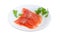 Sliced fillet of salted rainbow trout on a white dish