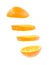 Sliced flying orange isolated on white background. cut orange in pieces isolated on white background. Levity fruit floating in the