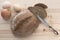 Sliced fresh bread, eggs, onions and a vintage knife on a light wooden background. Crumbs of bread