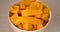 Sliced fresh mangoes lying in a bowl.