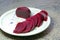 Sliced fresh red beetroot on a plate.