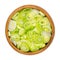 Sliced fresh scallions, chopped bulbs of green onions, in a wooden bowl