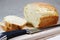 A sliced, freshly baked loaf of bread.