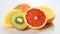 sliced fruits against white background