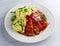 Sliced Gammon Steak with mashed potato on wooden white background.