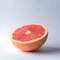 Sliced grapefruit  on white background. Minimal fruit concept