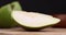 Sliced green ripe pear