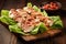 sliced, grilled chicken on bacon bits sprinkled over lettuce