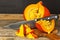 Sliced Hokkaido Pumpkin. Preparation of pumpkin soup. Vegetable growing. Hokkaido pumpkin on a wooden table.