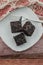 Sliced homemade brownies on white plate. Served on rectangle white plate. Favorite chocolate dessert for chocolate lover. Sweet