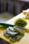 sliced kiwi. preparation of fruit for crepes. yellow cutting board