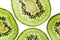 Sliced kiwifruit rings on white background top view macro