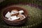 Sliced large slices of raw white mushrooms in brown earthenware