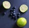 Sliced lemons and Blueberries on a dark background