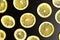 Sliced lemons on a dark background pattern