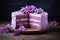 Sliced Lilac cake with blueberries on dark wooden table