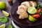 Sliced lime pork tenderloin on dark canvas background close up