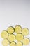 Sliced lime ringlets lie on a white background