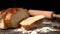 Sliced loaf of bread falling on flour