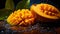 Sliced mango fruit with water splash on wooden table background