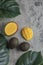 Sliced mango and ripe avocado fruits on marble surface