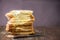 Sliced of marble bread on rustic wooden table. With copy space