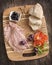 Sliced mortadella with bread, tomato and olives