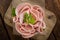 Sliced Mortadella on wooden background