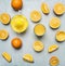 Sliced oranges, a juicer, a glass of juice wooden rustic background top view close up
