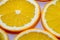 Sliced oranges lying on a light surface