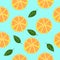 Sliced oranges seamless pattern with leaves