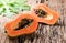 Sliced papaya fresh fruit on wood background