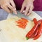 Sliced peppers on wood plate