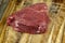 sliced piece of fresh raw beef during salting