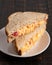 Sliced Pimento Cheese Sandwich on Wooden Table