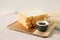 Sliced plain bread with jam on wooden tray