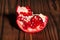 Sliced pomegranate on wood