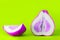 Sliced pomelo bright purple lilac on a light green acid color background