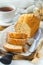 Sliced pound cake with almonds on the cutting Board