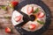 Sliced pound cake with fresh mint and strawberries close-up. horizontal top view