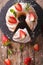 Sliced pound cake with fresh mint and strawberries close-up. Vertical top view