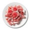 Sliced prosciutto crudo (raw ham) arranged in the shape of roses on white background with clipping path