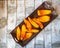 Sliced pumpkin on an oblong wooden tray