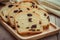 Sliced raisin bread on wooden plate