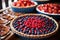 sliced red and blue fruit pies on a buffet