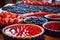 sliced red and blue fruit pies on a buffet