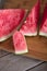 Sliced red-fleshed watermelon on table