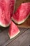 Sliced red-fleshed watermelon on table