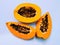 Sliced ripe papaya fruit with black seeds carica-papaya raw papaw pawpaw yellow papeeta papaye lechoza cut halved mamao photo